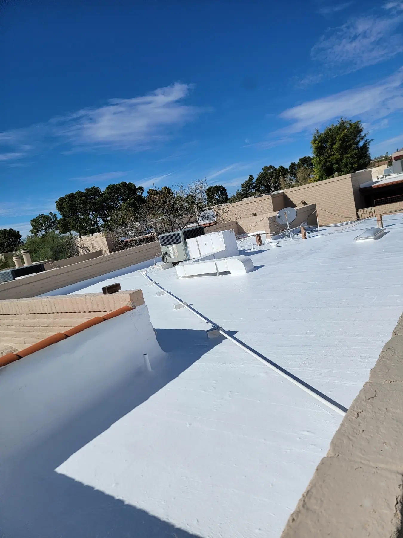 Reflective low-slope roof around HVAC equipment